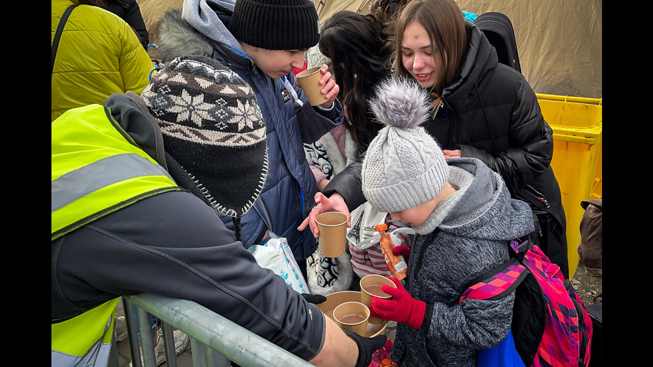 Refugee Families Welcomed to Poland With Hot Chocolate