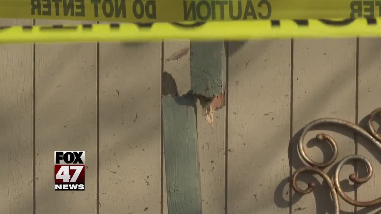 Lansing car hits home, two hospitalized