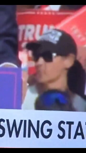 Pay close attention to the woman in the black hat!