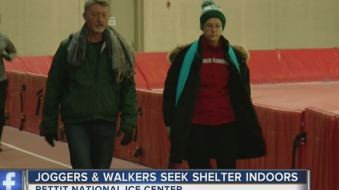 Joggers and walkers seek shelter indoors