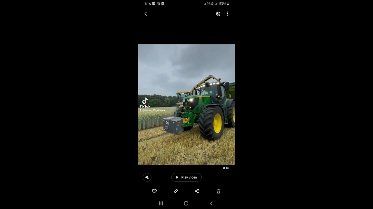 Harvesting of crop by farmaer drive John deere