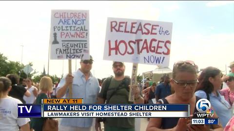 Hundreds march to Homestead immigrant shelter, lawmakers visit