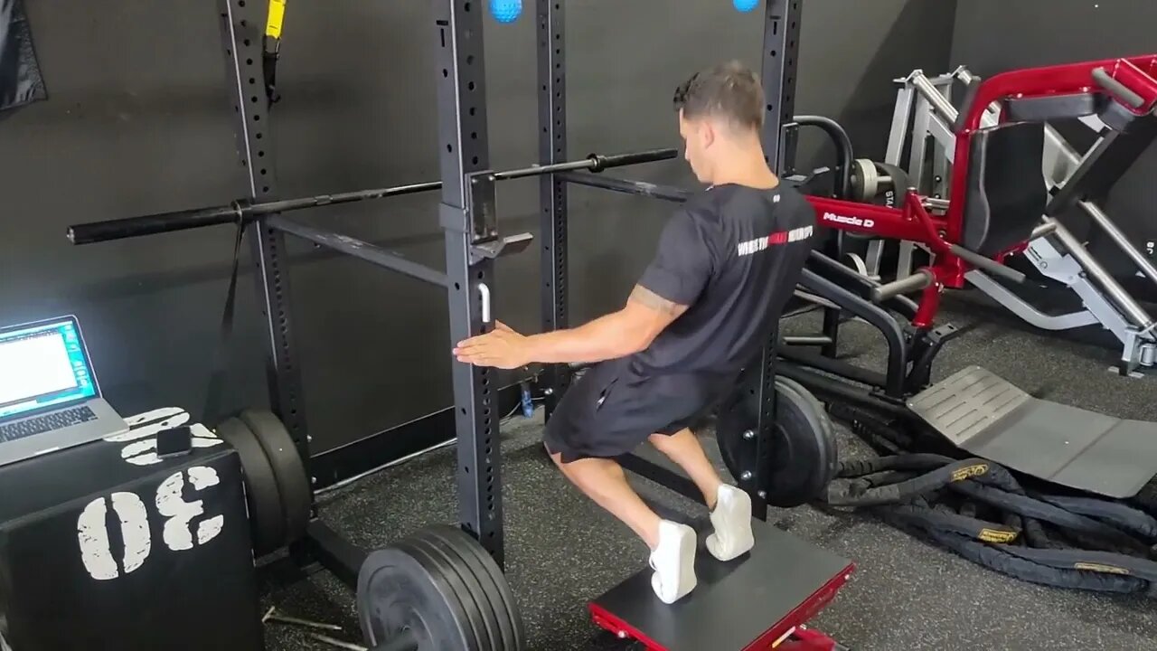 Rack Assisted Deep Deficit Sissy Squat