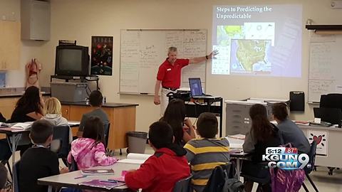 KGUN 9 On Your Side's meteorologist, Cuyler Diggs, speaks at Robins K-8 School