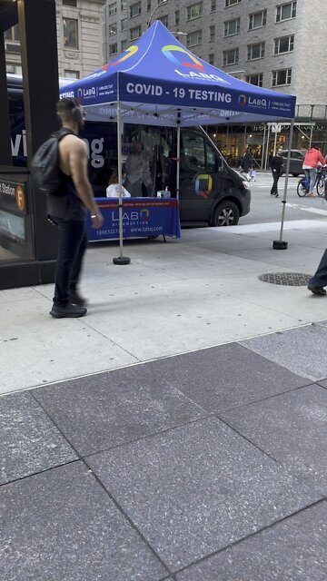 c0vid testers on their phone with mask pulled down. there is no line too loooool