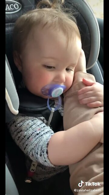 Sweet Baby Lovingly Holds On To Her Mom's Arm