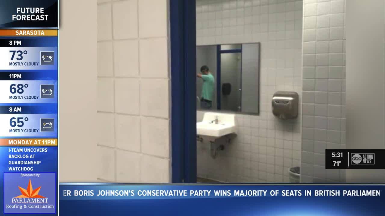 Student stages photo of him peeing in urinal to show that 'No bathroom door' policy is violation of privacy