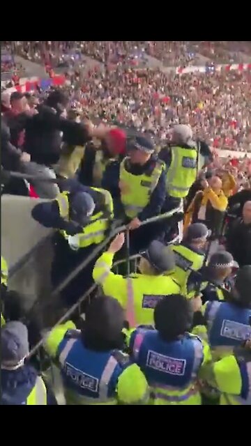 Metropolitan police running away from Hungary supporters at Wembley stadium