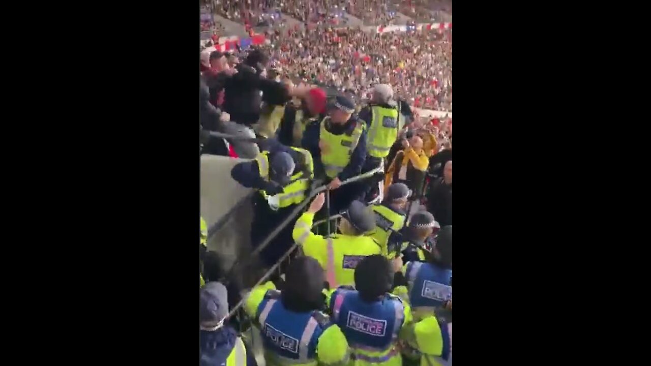 Metropolitan police running away from Hungary supporters at Wembley stadium