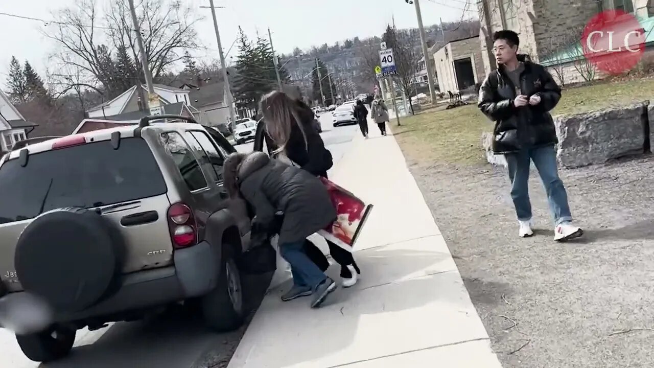 Woman steals signs during anti-abortion activism