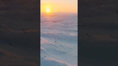 The sun shines on snow covered land #shorts