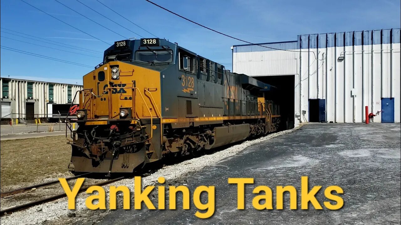 CSX pulls tankers from a building