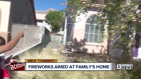 Stranger throws lit fireworks into family’s yard, sparking flames
