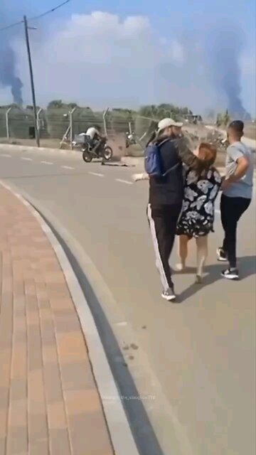"Innocent" Palestinazi civilians lead an Elderly Israeli woman to Gaza on Oct.7th.