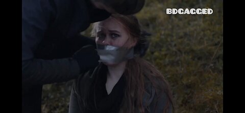 The bandit tied the girl with tape