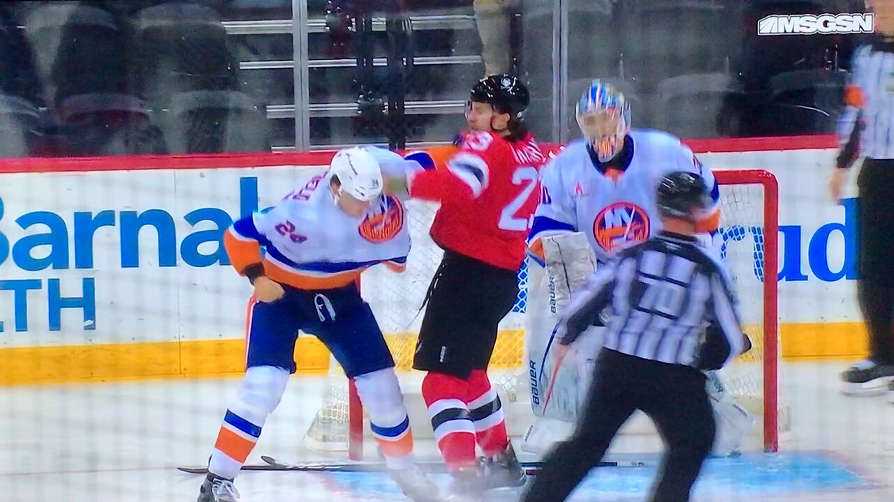 Islanders #20 A. Romanov gets drilled by Devils #23 K. MacDermid