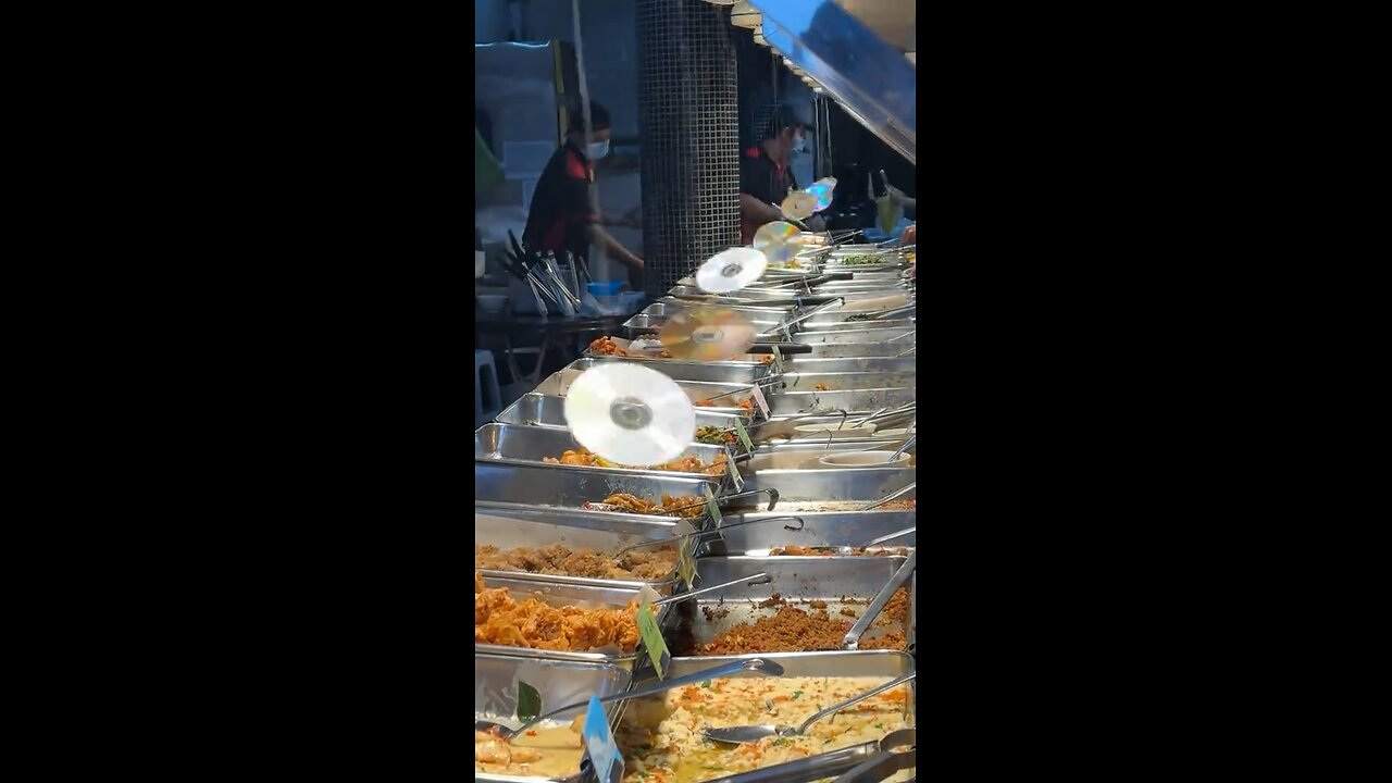 What is the CD doing over top of the buffet?