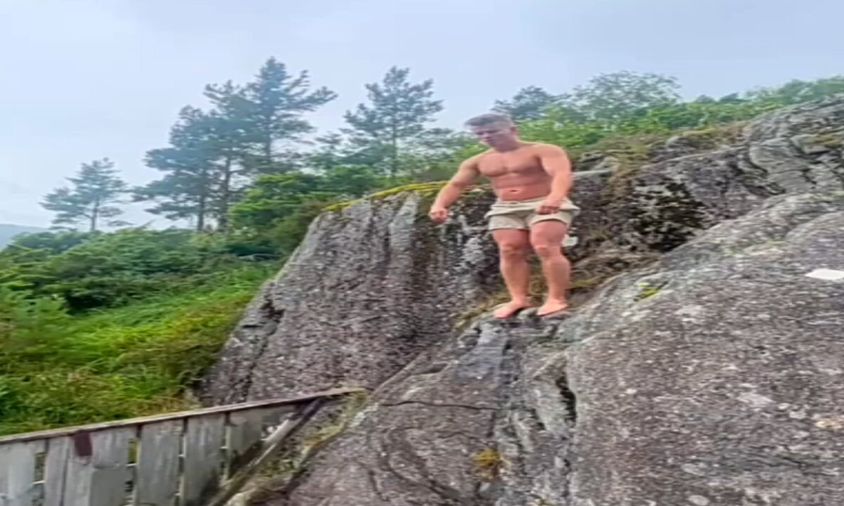 Fearless dude jumps on a slide with no room for mistakes