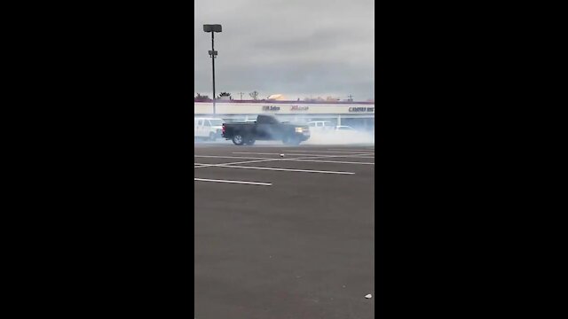 CRAZY Scene: Man Rams Police Cruiser, Does Donuts in Wild Parking Lot Video