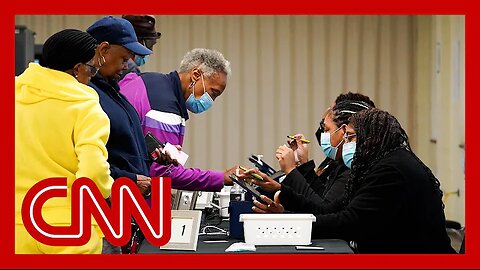 Georgia saw record turnout for first day of early voting. Analysts explain what it may mean