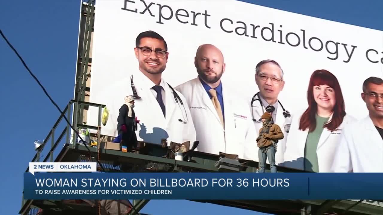 Woman staying on Stillwater billboard for a cause