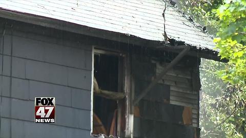 Crews battle house fire in Lansing