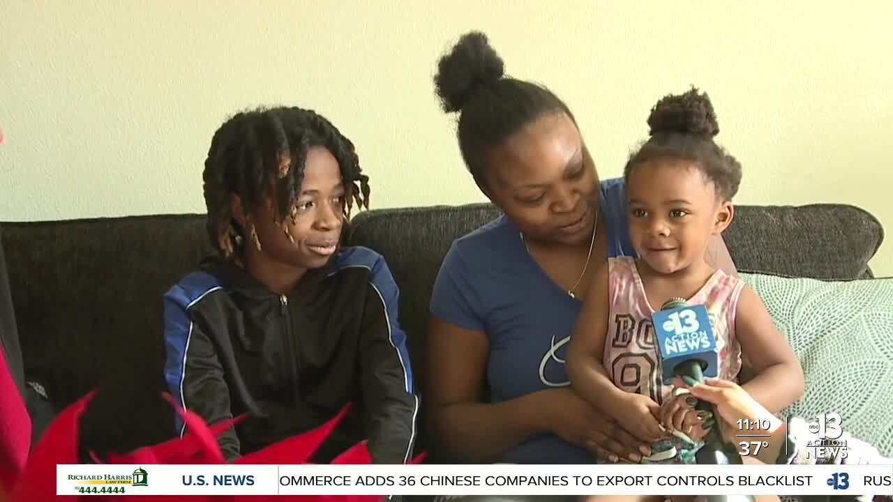 Two Metro officers surprise mother of seven with furniture for "Home for the Holidays"