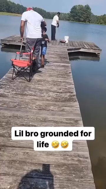 His son got mad and pushed him in the lake