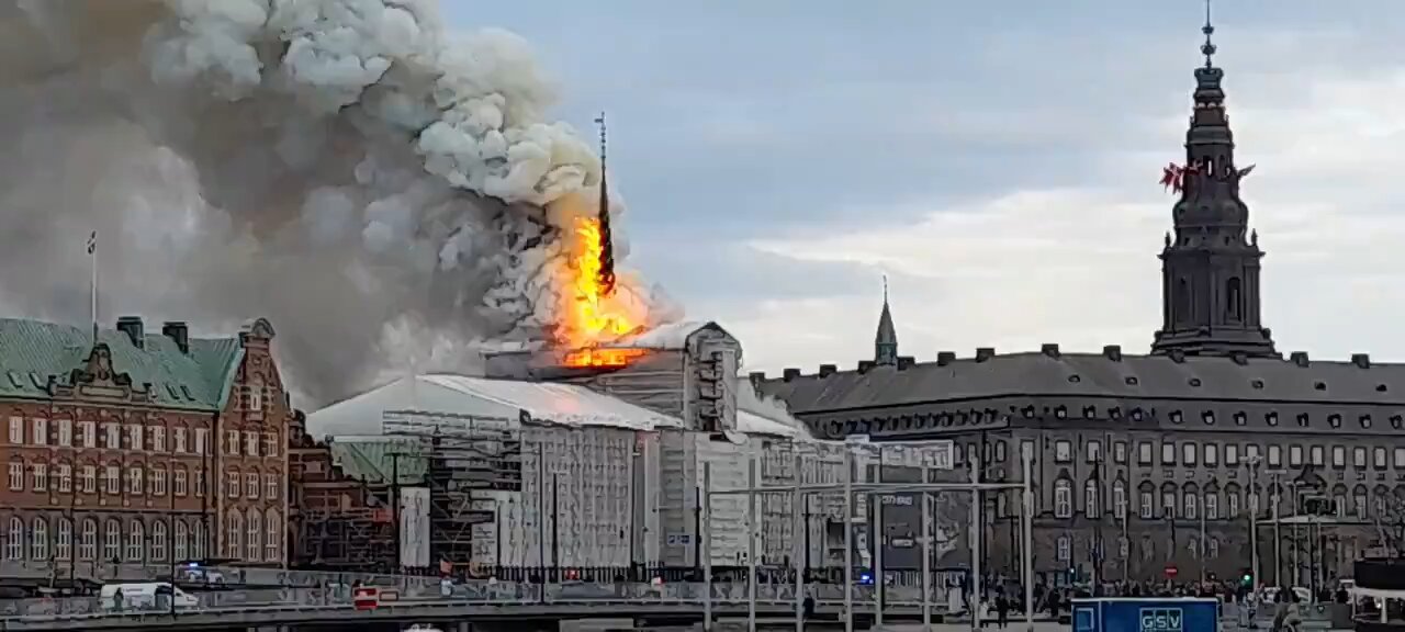 Massive fire rages through 17th-cent. old Stock Exchange in Copenhagen, Denmark, its spire collapsed