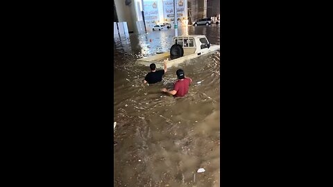 Footage Captures two man and Car struck in water