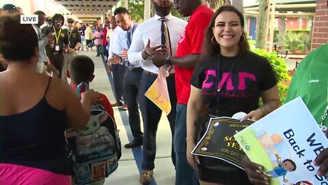 High-fives and cheers for returning students