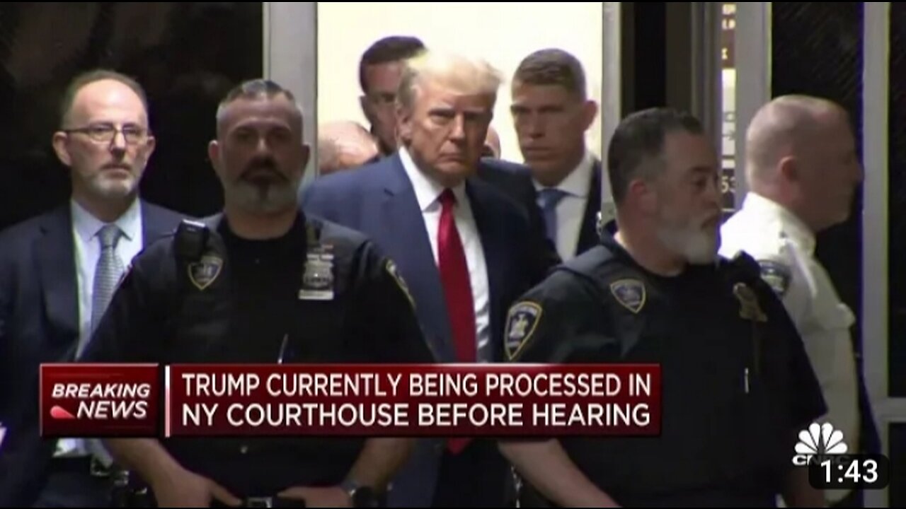 Donald Trump enters New York City courtroom following arrest processing