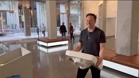 Elon Musk walks into Twitter with a Bathroom Sink.