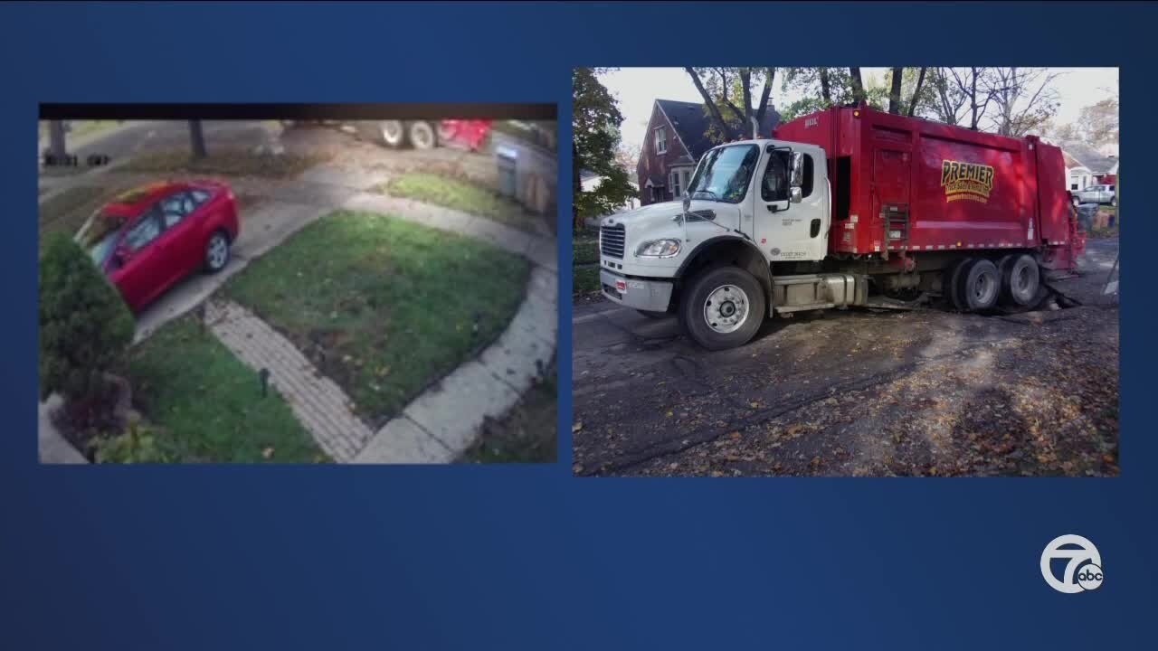 Garbage truck caught in sinkhole