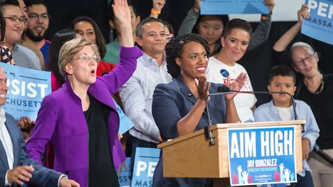 Elizabeth Warren Gets Heckled, Freezes & Is Rescued By Ayanna Pressley | There's A Buttigieg Twist