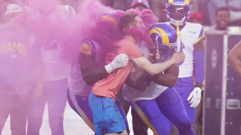 Rams player tackles protester running on field