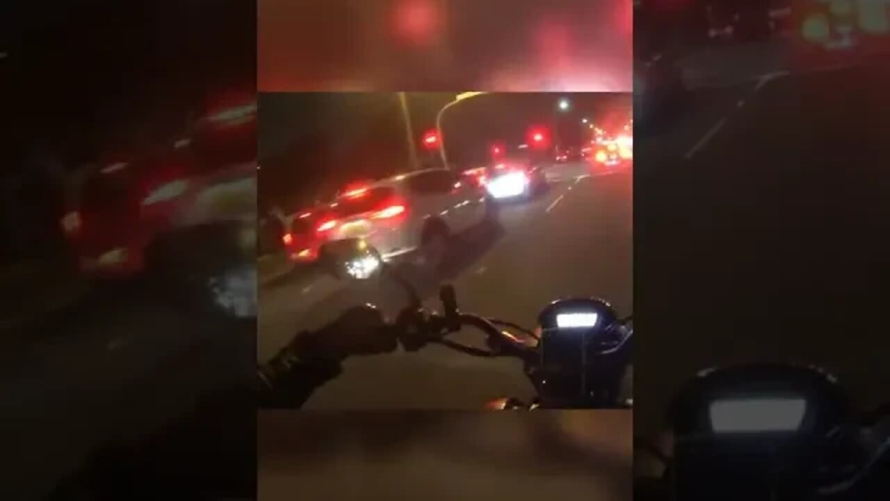 biker rear-ends a vehicle in front of cops...