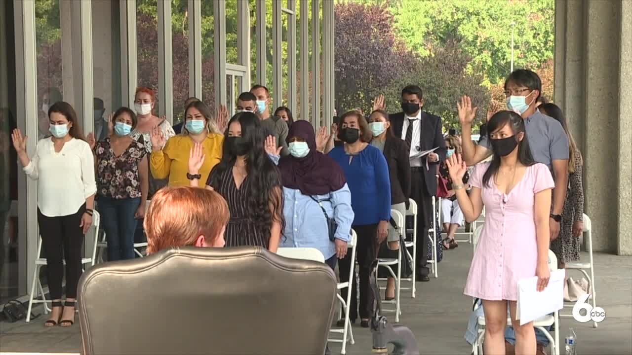 59 people become new U.S. citizens in three outdoor ceremonies