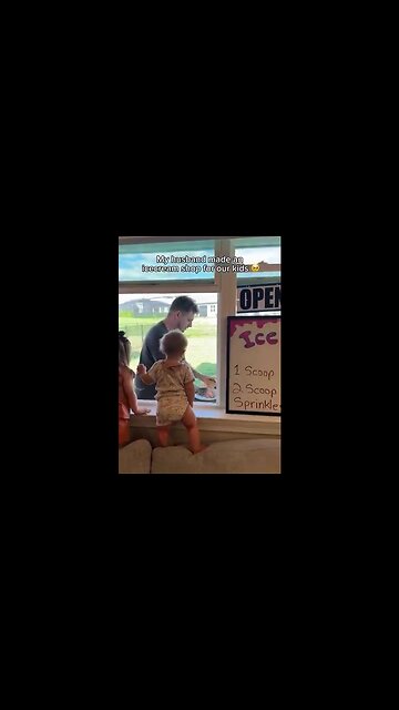 Dad sets up an ice cream shop at the living room window