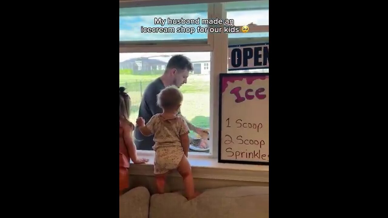 Dad sets up an ice cream shop at the living room window