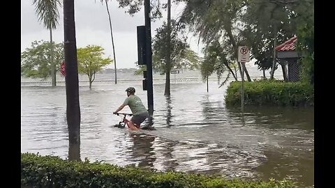 Man Tries To Bike Ride Through Floods From Hurricane Idalia