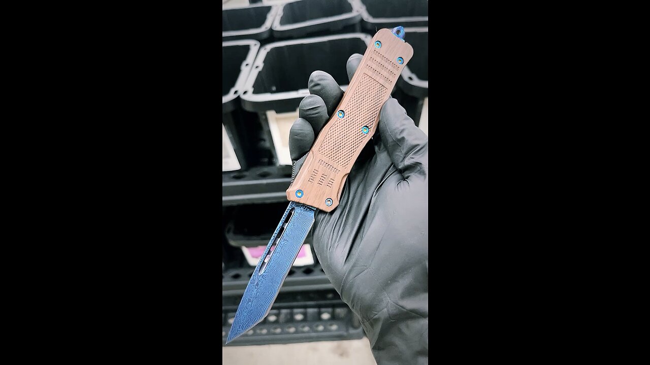 More blue Damascus OTF knives