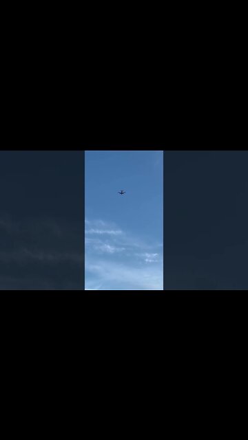 An airplane above the beach