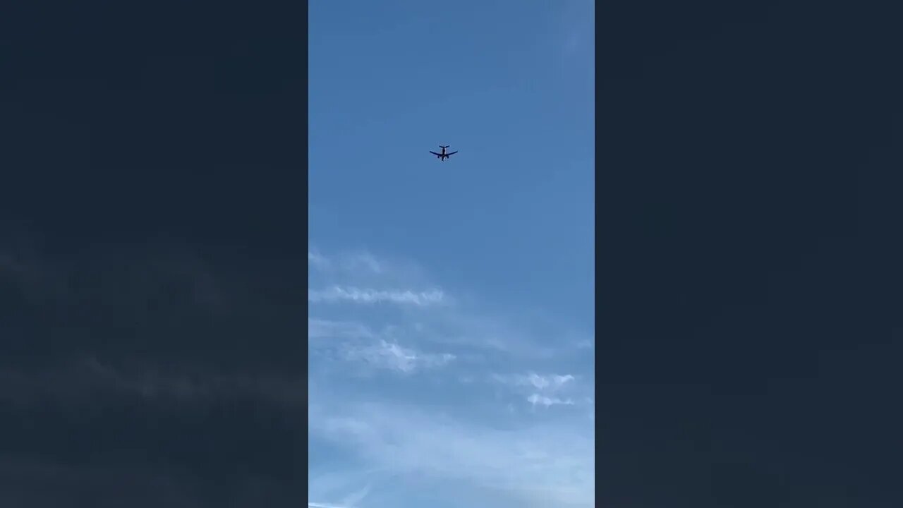 An airplane above the beach