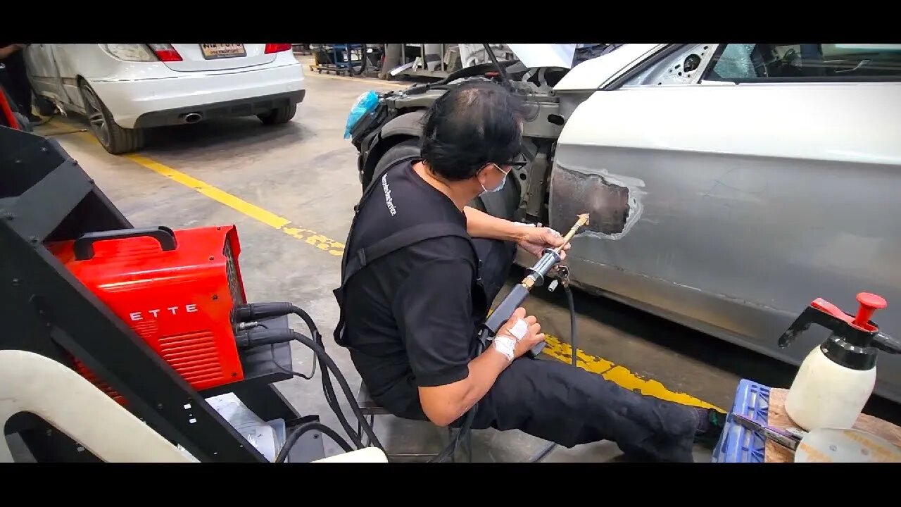 Side damage repair with Celette spotter dent puller