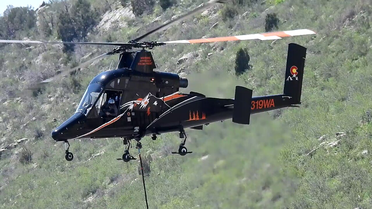 Skilled Pilot Hangs Electric Power Lines