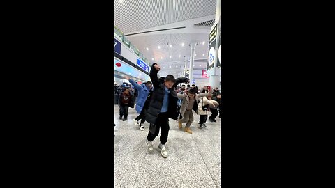 Traditional dance performance of Uyghur Turkish children at the airport.