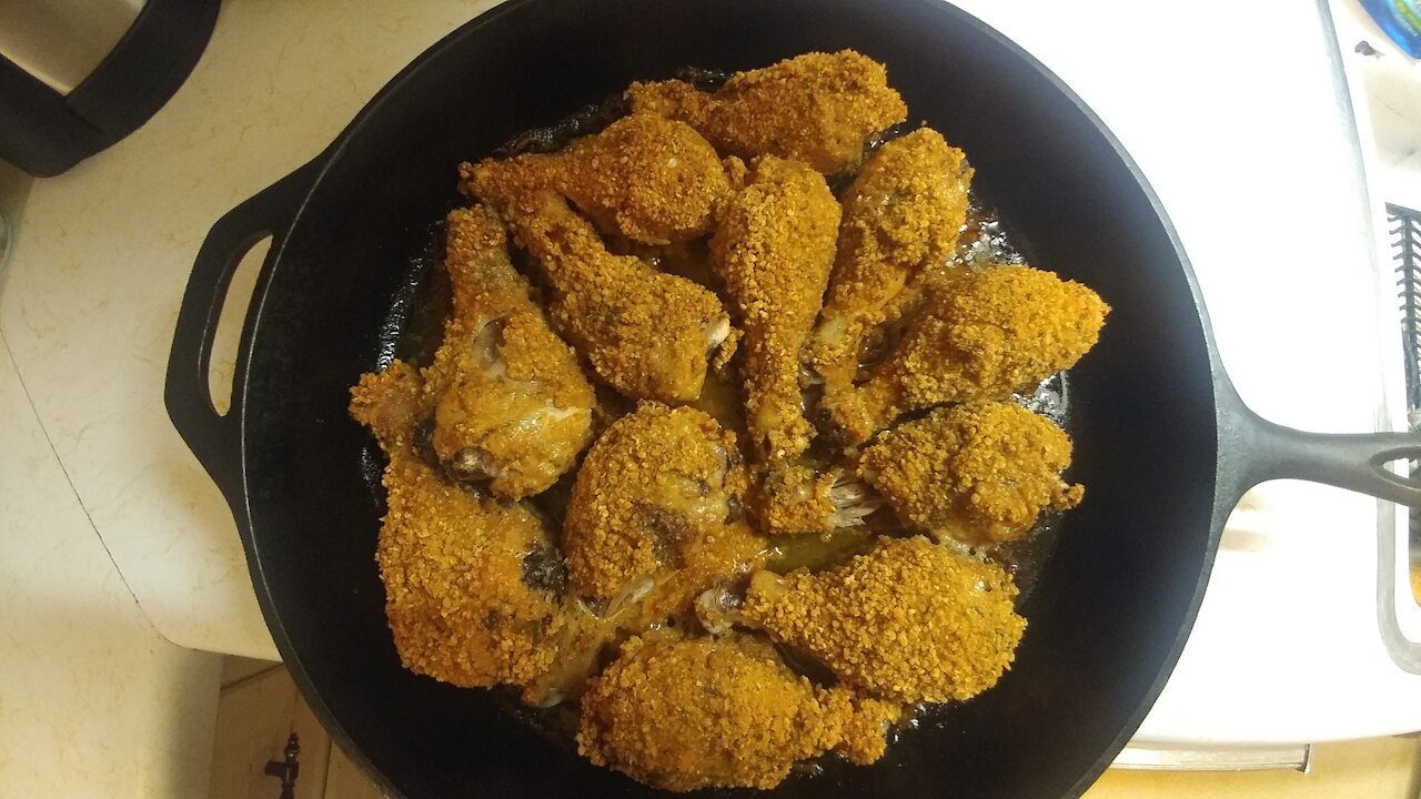 Spicy gluten-free oven fried chicken in a cast iron pan