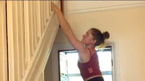 Pilates instructor does climbing at home