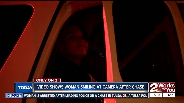 Woman smiling at camera after police chase